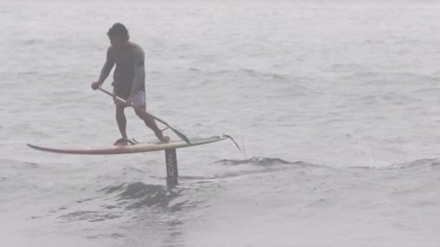 Hobie Team rider Bullet Obra foiling on his Stand Up Surfboard.