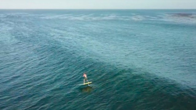 Laird Hamilton flight across Point Dume on his Foil Board 1 min ride