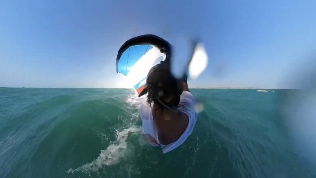 Off shore Prone downwind foiling using kiteboarder as support & Armstrong A-wing