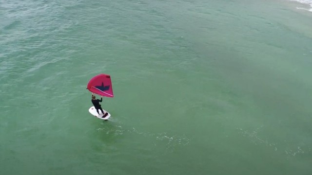 Riding Small Chop on a Wingfoil in New Zealand