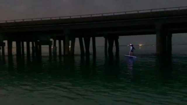 E-foiling Destin Pass at sunset with Nocqua led lights.