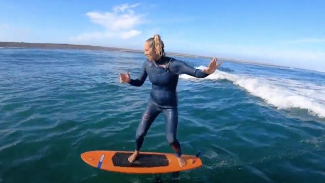 GETTING OUT ON SURFFOIL IN CRYSTAL WATER ..