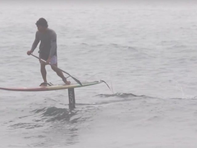 Hobie Team rider Bullet Obra foiling on his Stand Up Surfboard.
