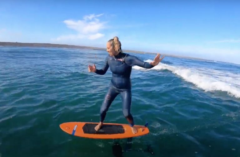 GETTING OUT ON SURFFOIL IN CRYSTAL WATER ..