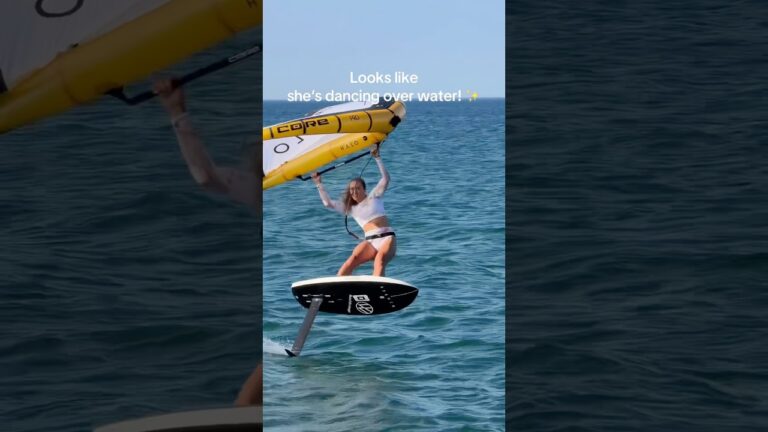 Why does it look like she’s DANCING OVER WATER? #watersports #wingfoil #dance #surfgirl #hair