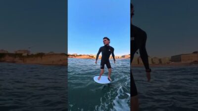 Foil Surfing thru a rock